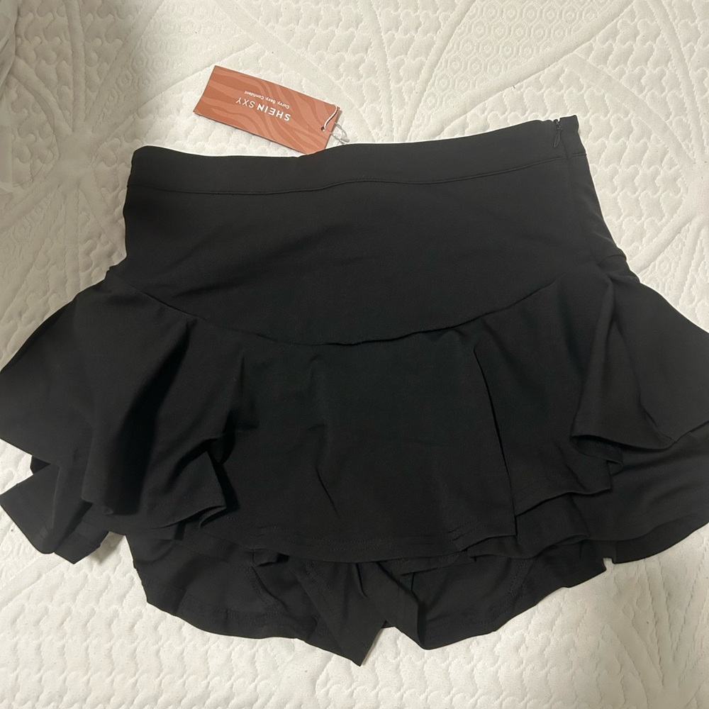 Black ruffled mini skirt